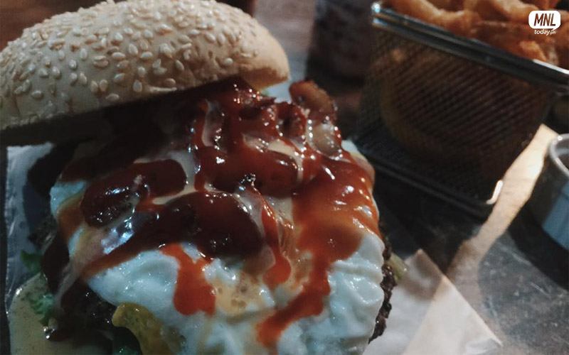 Basement Burger (add on: fried egg) with Curly Fries and Drinks, P165